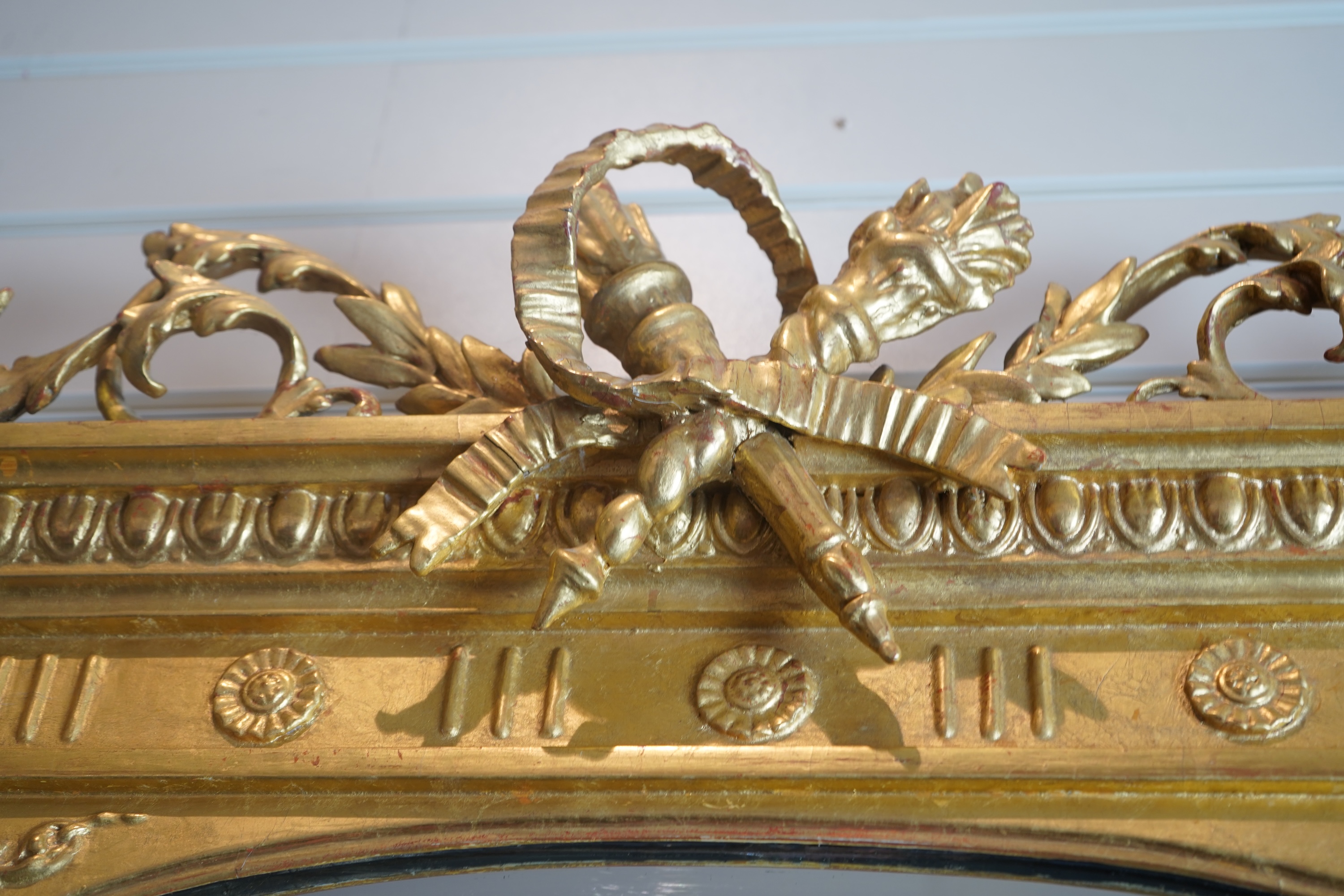 A pair of Louis XVI style giltwood and composition marble topped pier tables and mirrors